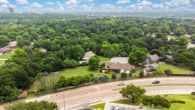 an aerial view of a house with a swimming pool