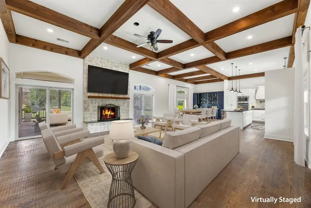 a view of empty room with wooden floor and fireplace