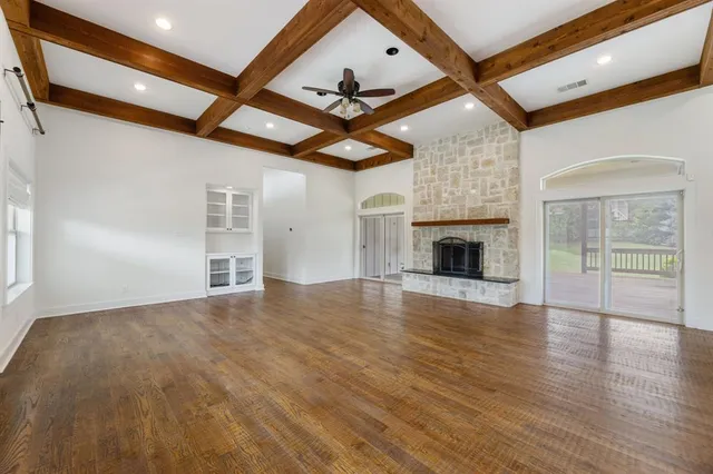 a living room with fireplace furniture and a fireplace
