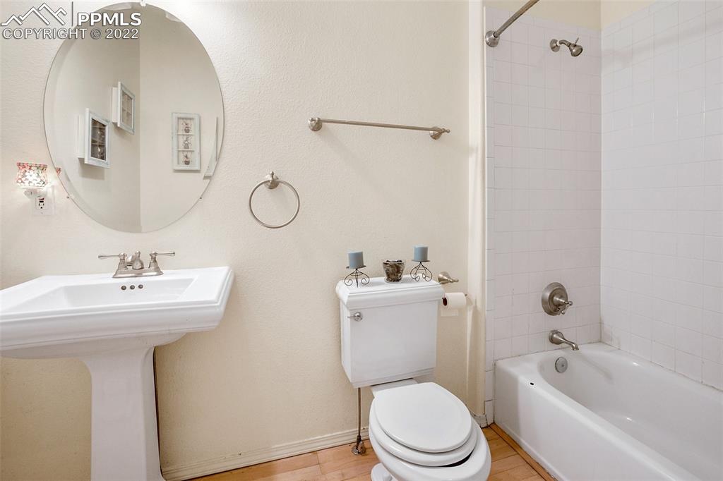 4053 Omer Lane Divide, CO 80814 - Photo 23 of 45 a bathroom with a toilet sink and mirror
