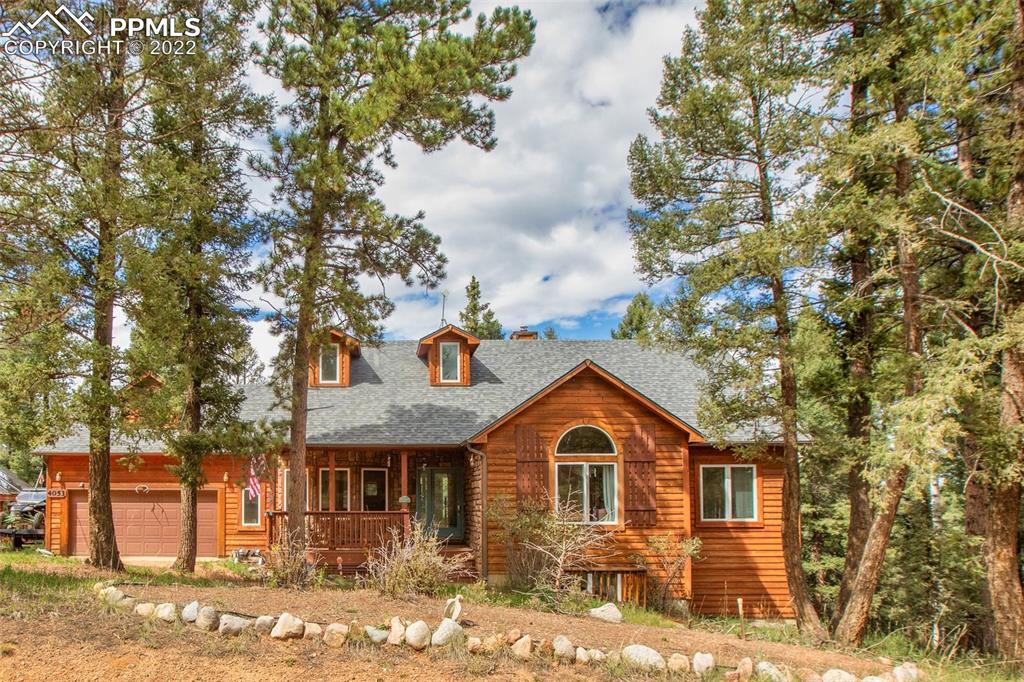 4053 Omer Lane Divide, CO 80814 - Photo 42 of 45 a front view of a house with a yard