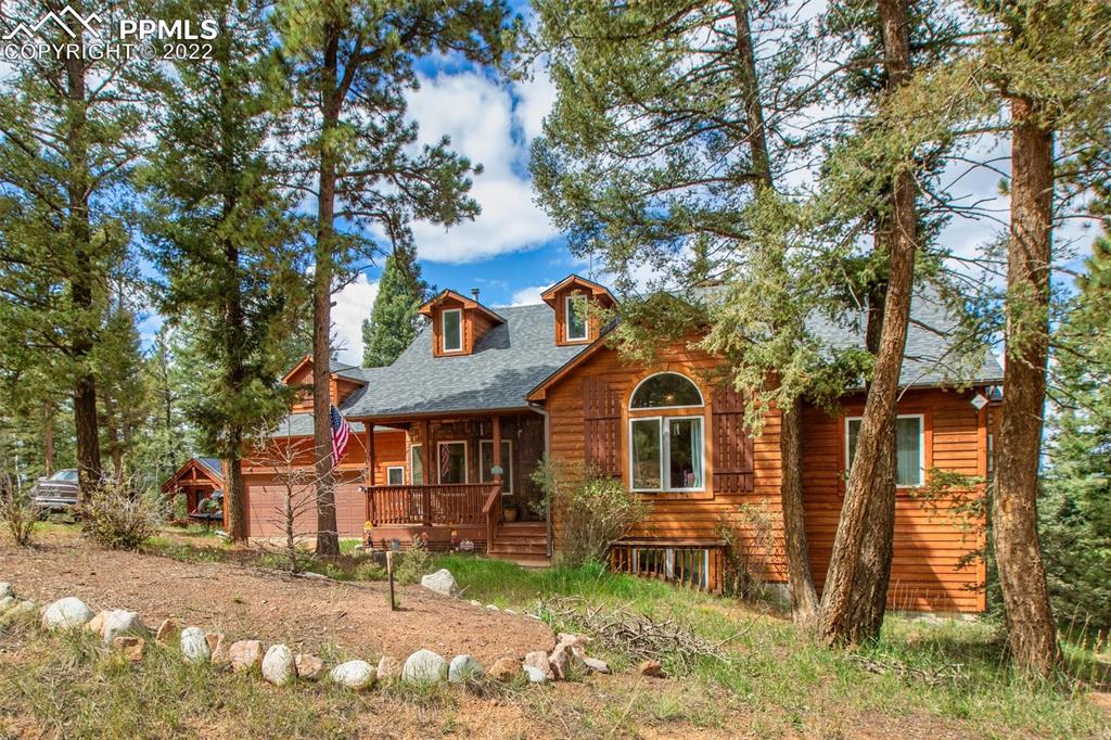 4053 Omer Lane Divide, CO 80814 - Photo 43 of 45 a front view of a house with a garden