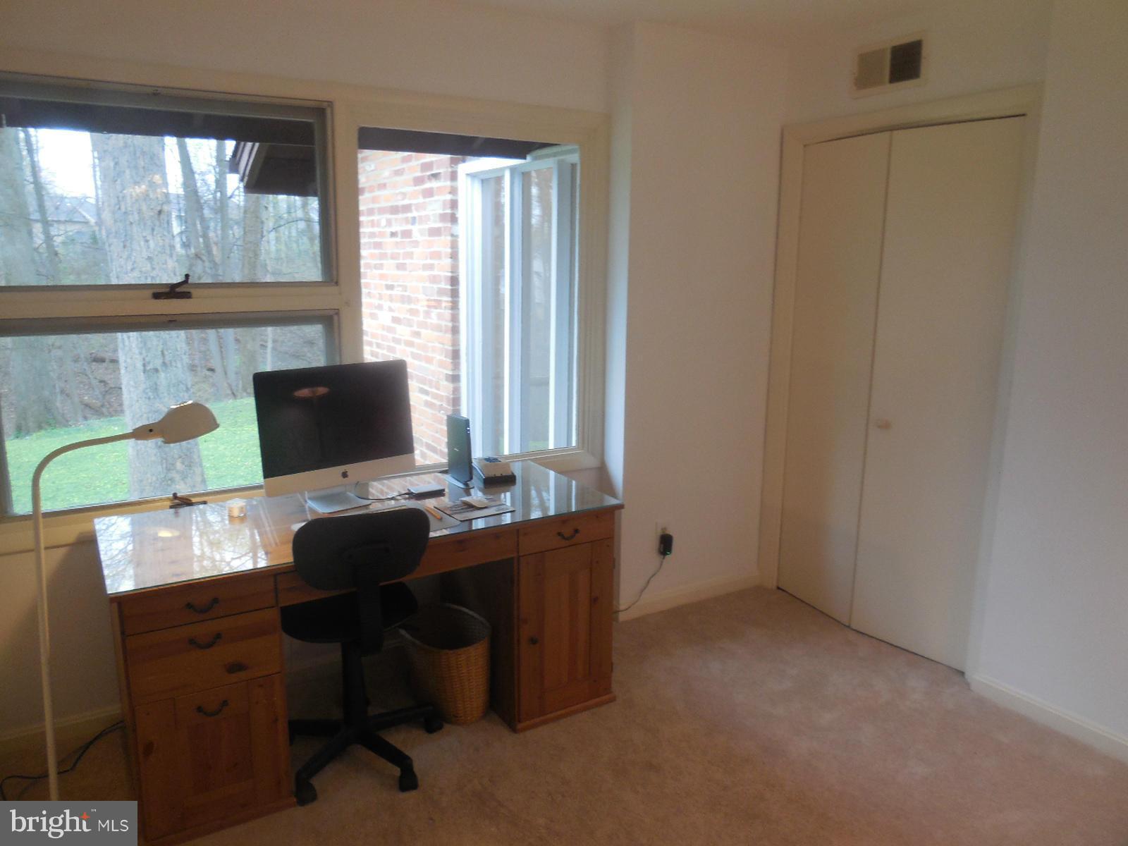 1908 Norvale Road Silver Spring, MD 20906 - Photo 11 of 30 a view of a workspace with furniture and a window