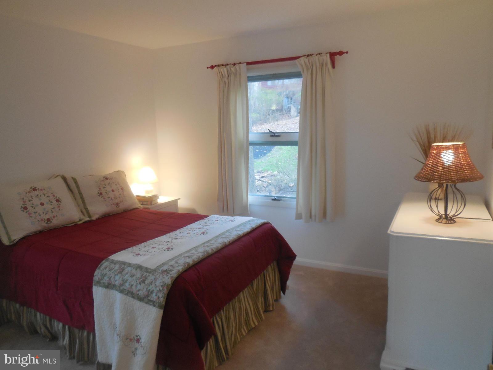 1908 Norvale Road Silver Spring, MD 20906 - Photo 13 of 30 a bedroom with a bed and a window