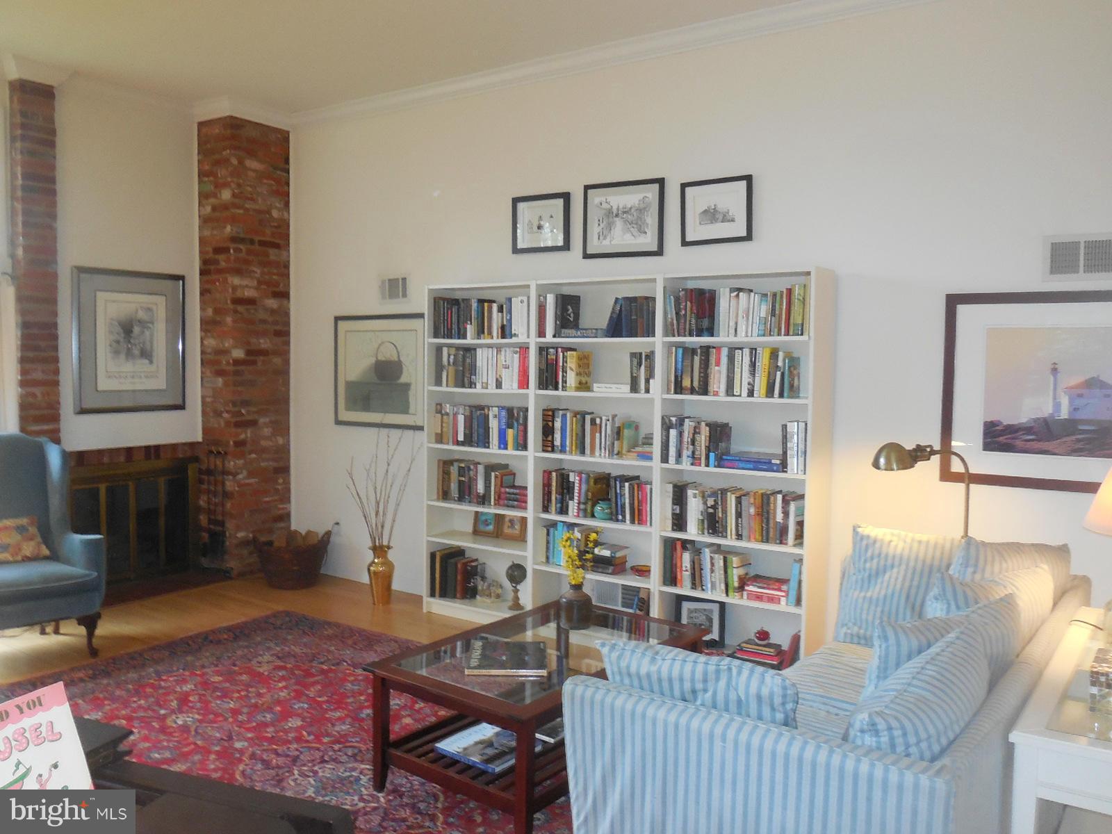 1908 Norvale Road Silver Spring, MD 20906 - Photo 16 of 30 a living room with furniture and a book shelf