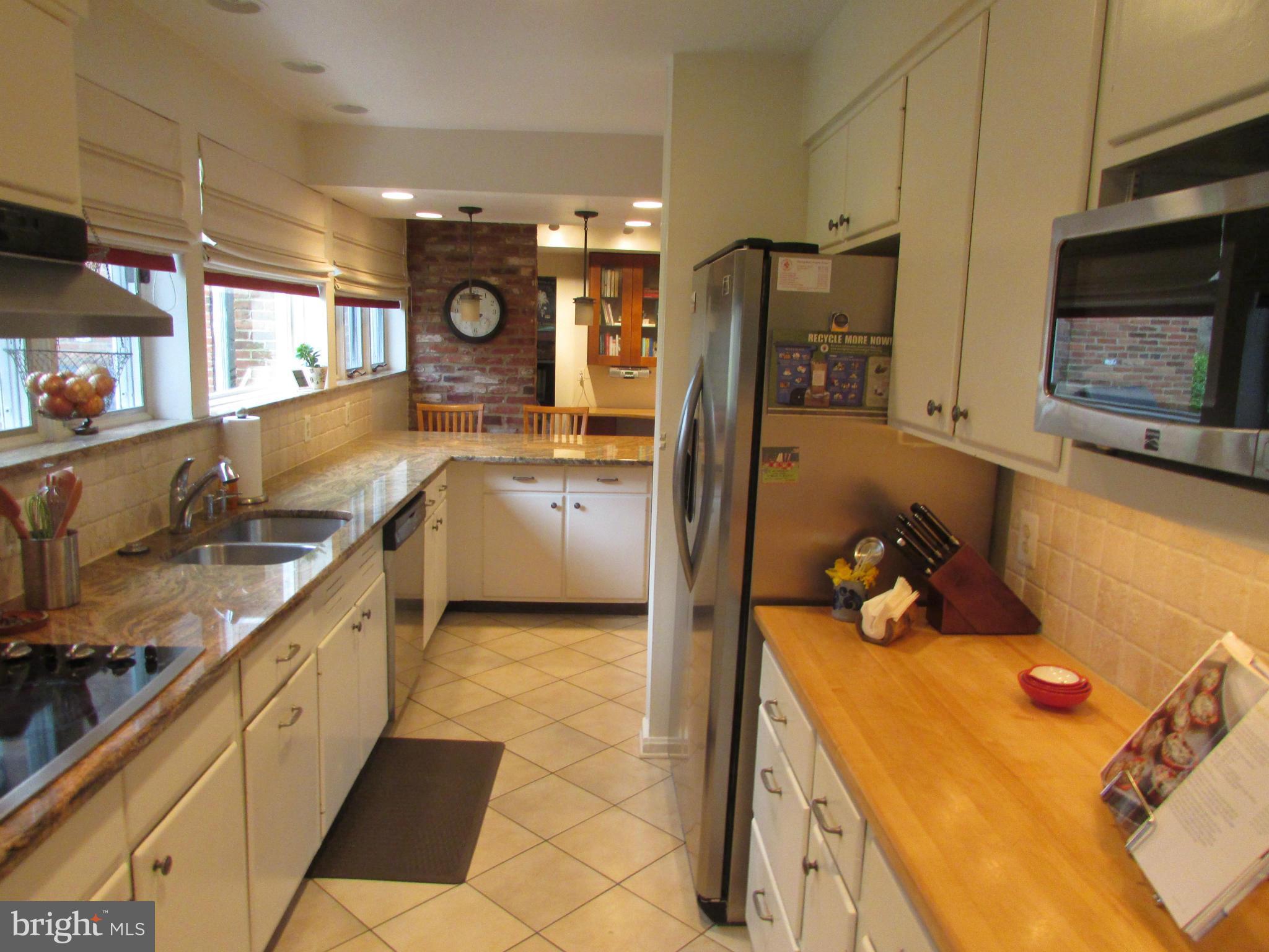 1908 Norvale Road Silver Spring, MD 20906 - Photo 20 of 30 a kitchen with a sink appliances and cabinets