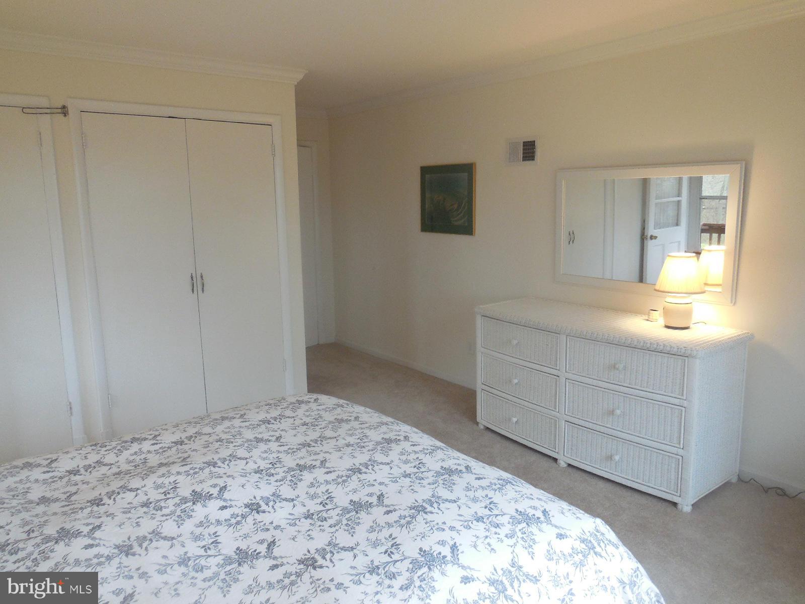 1908 Norvale Road Silver Spring, MD 20906 - Photo 7 of 30 a bedroom with a bed and a dresser