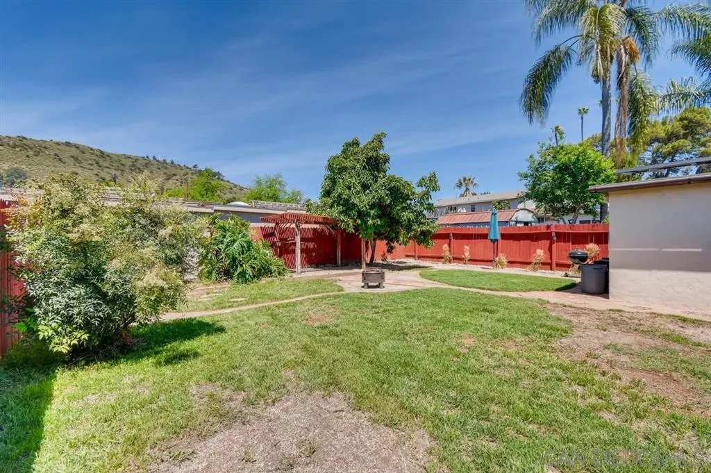 8236 Linden Road Lakeside, CA 92040 - Photo 11 of 12 a backyard of a house with lots of green space and fountain