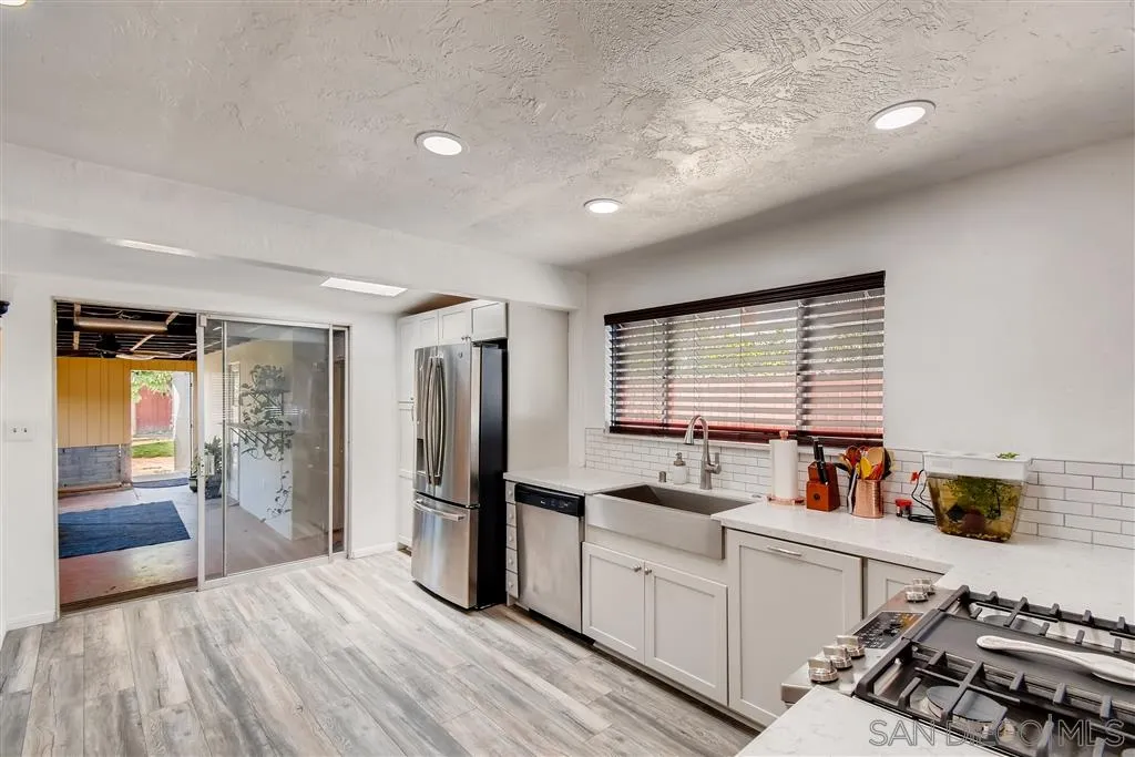 8236 Linden Road Lakeside, CA 92040 - Photo 3 of 12 a kitchen with a refrigerator and a sink