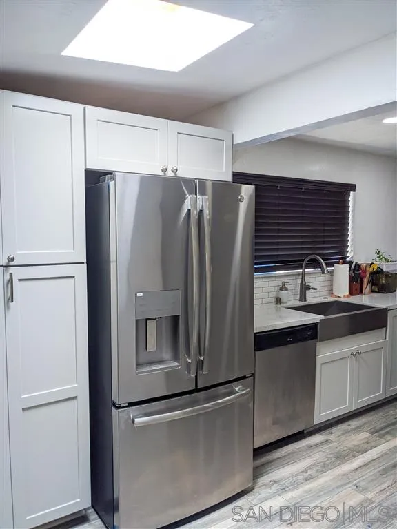 8236 Linden Road Lakeside, CA 92040 - Photo 4 of 12 a kitchen with stainless steel appliances and refrigerator