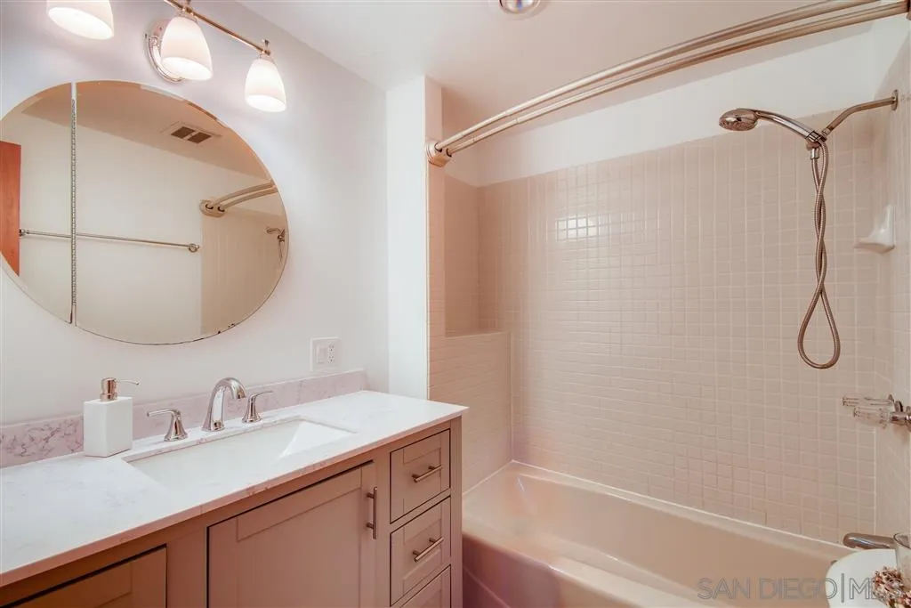 8236 Linden Road Lakeside, CA 92040 - Photo 6 of 12 a bathroom with a granite countertop sink a shower and a mirror