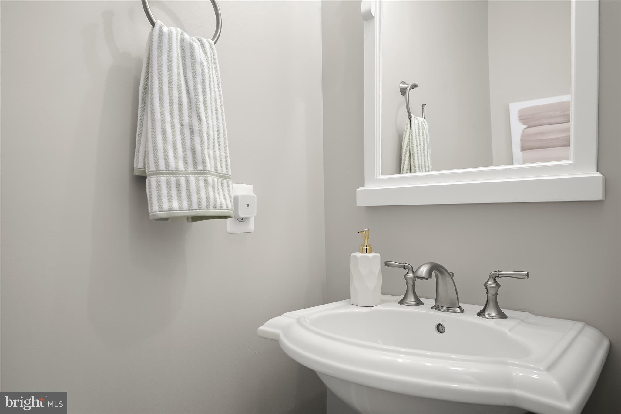 7905 Maple Lawn Boulevard Fulton, MD 20723 - Photo 18 of 49 a bathroom with a sink and a window