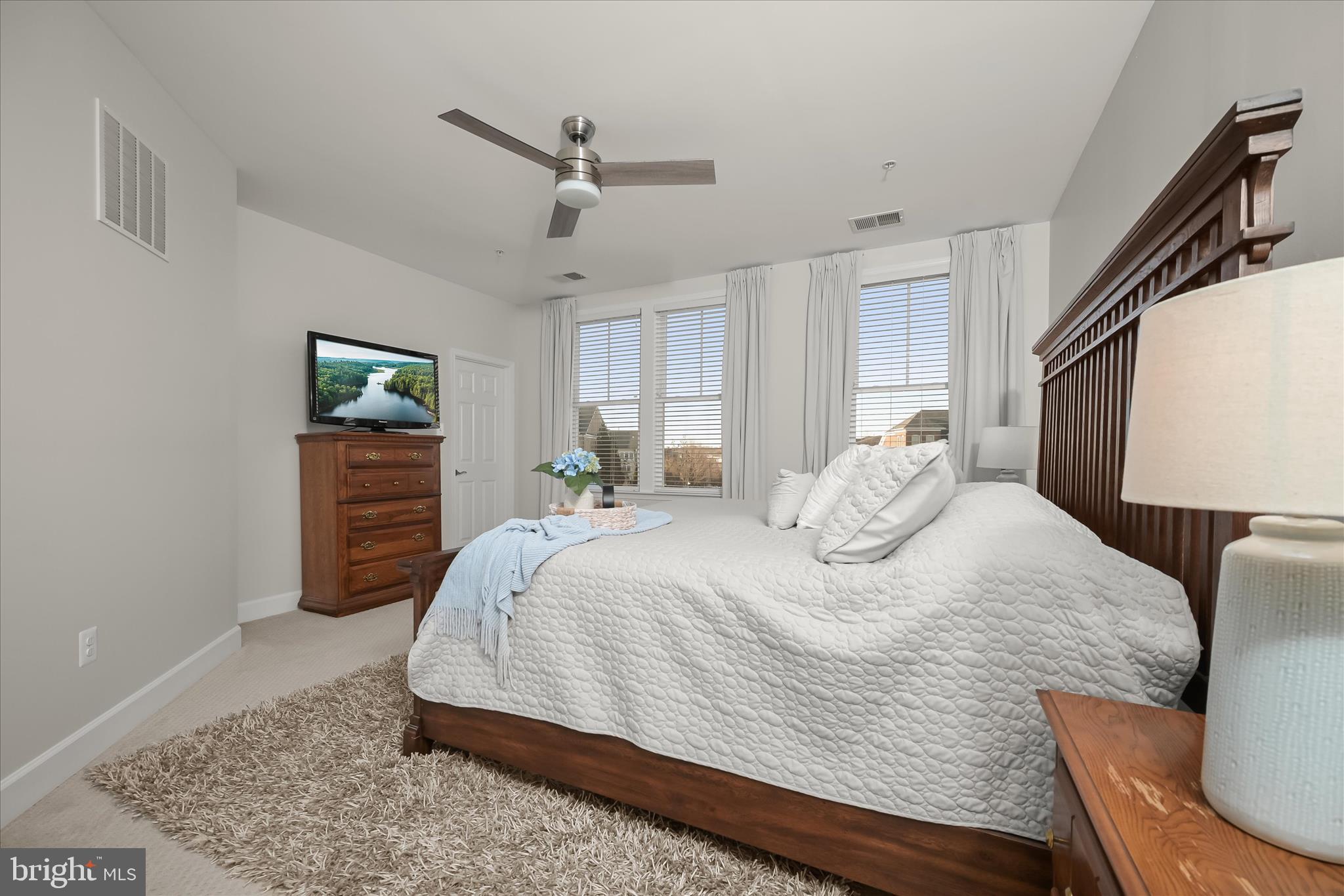 7905 Maple Lawn Boulevard Fulton, MD 20723 - Photo 21 of 49 a large bedroom with a bed and wooden floor