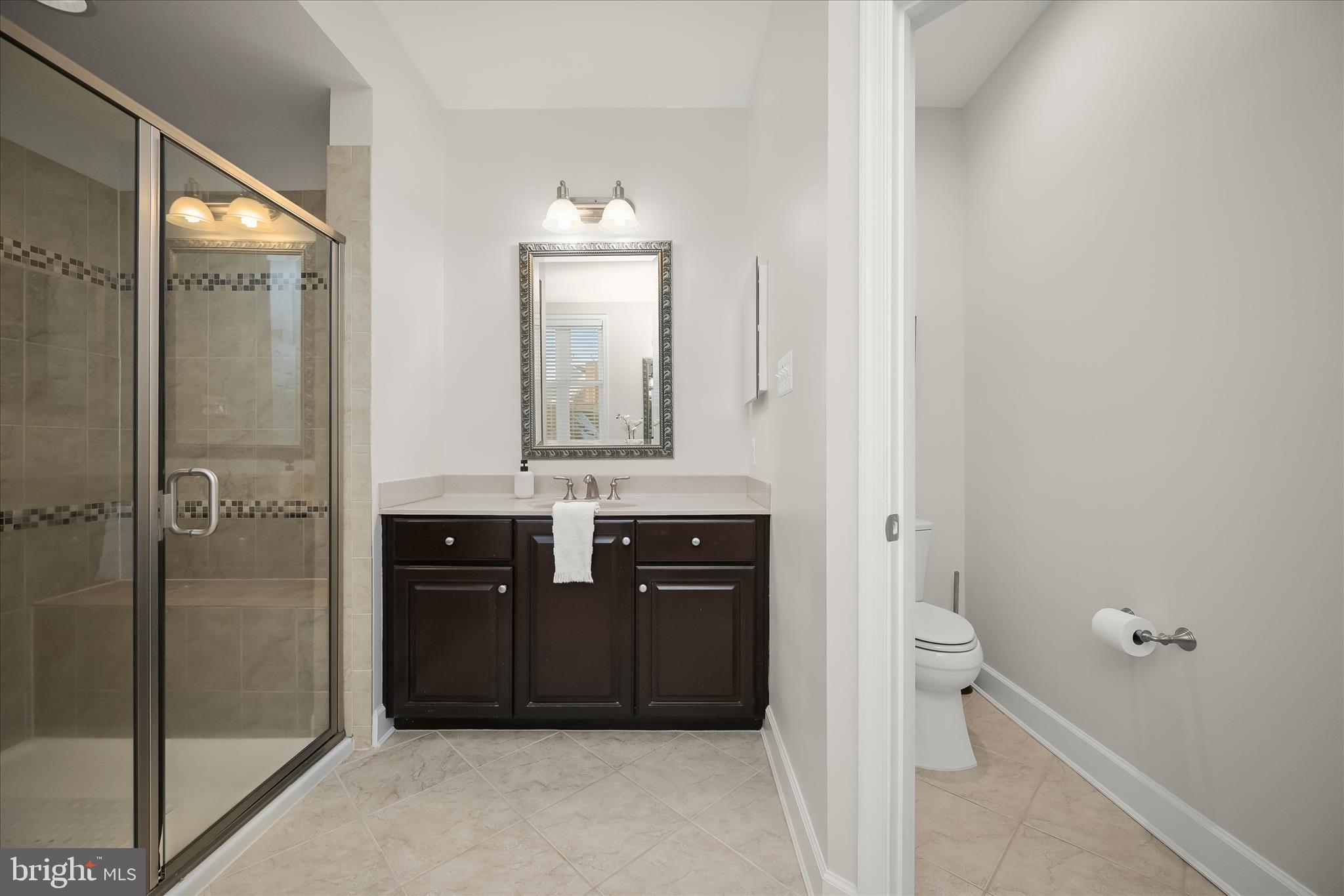 7905 Maple Lawn Boulevard Fulton, MD 20723 - Photo 25 of 49 a bathroom with a sink a toilet and shower