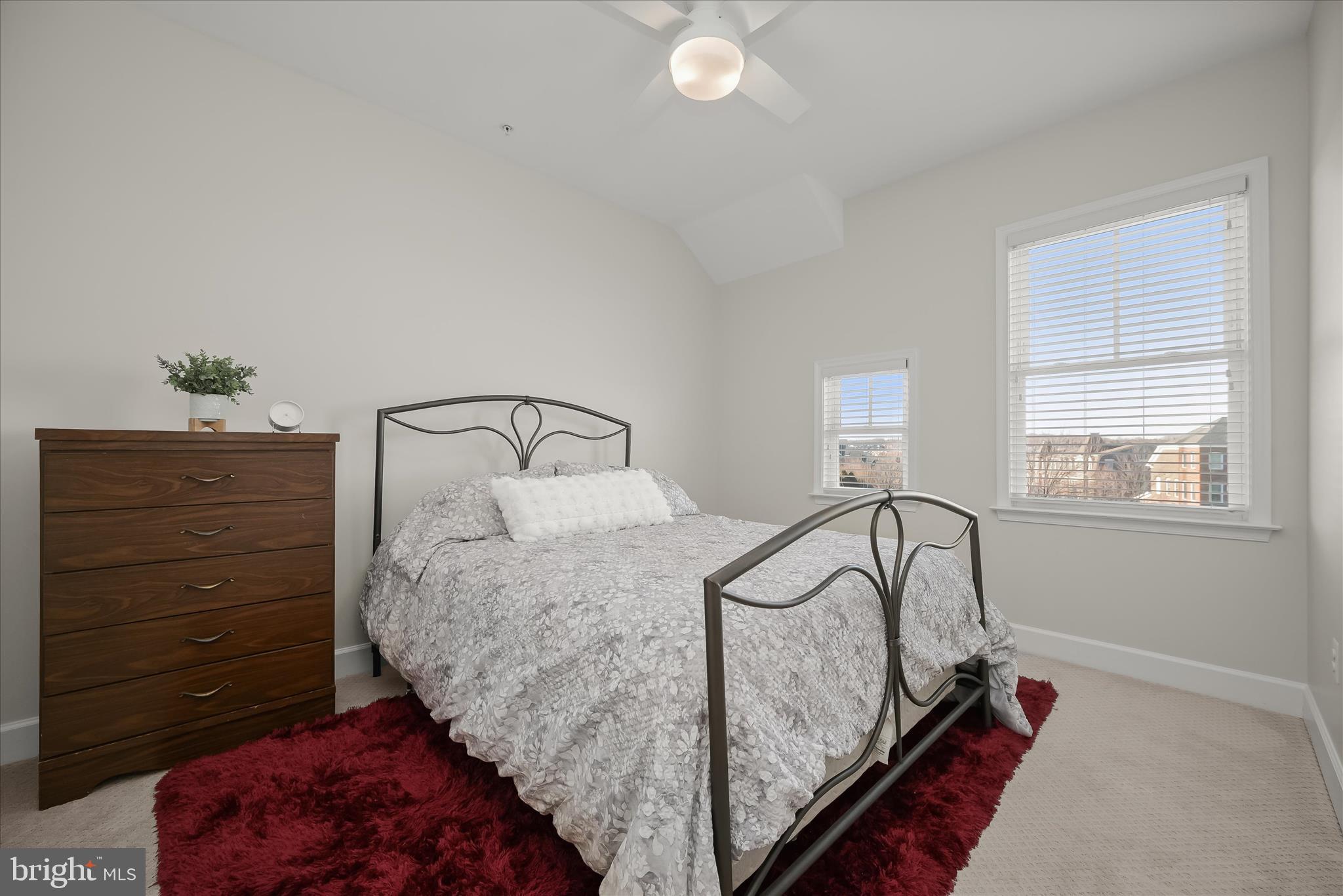 7905 Maple Lawn Boulevard Fulton, MD 20723 - Photo 31 of 49 a bed sitting in a bedroom next to a window