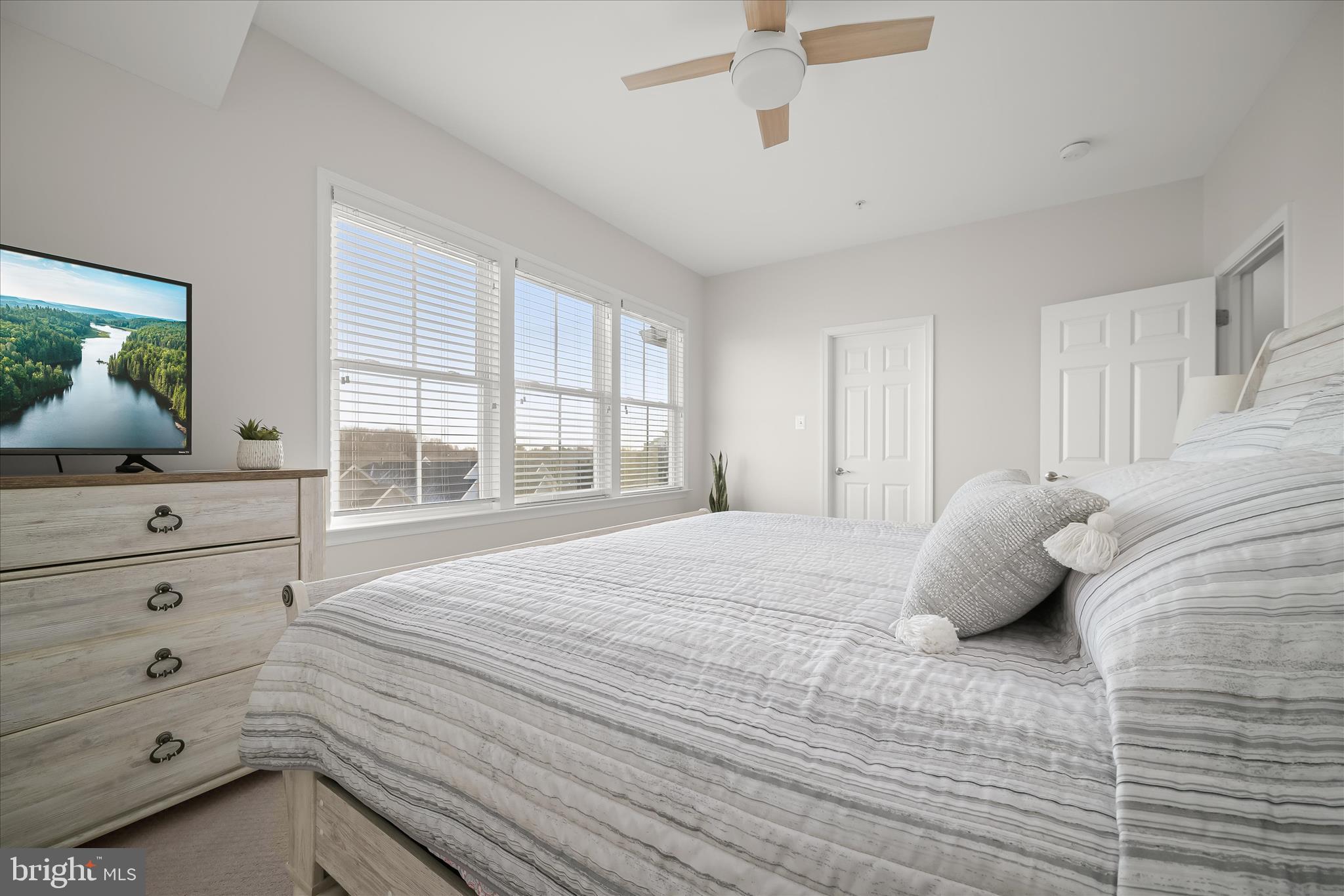 7905 Maple Lawn Boulevard Fulton, MD 20723 - Photo 35 of 49 a bedroom with a bed and a window