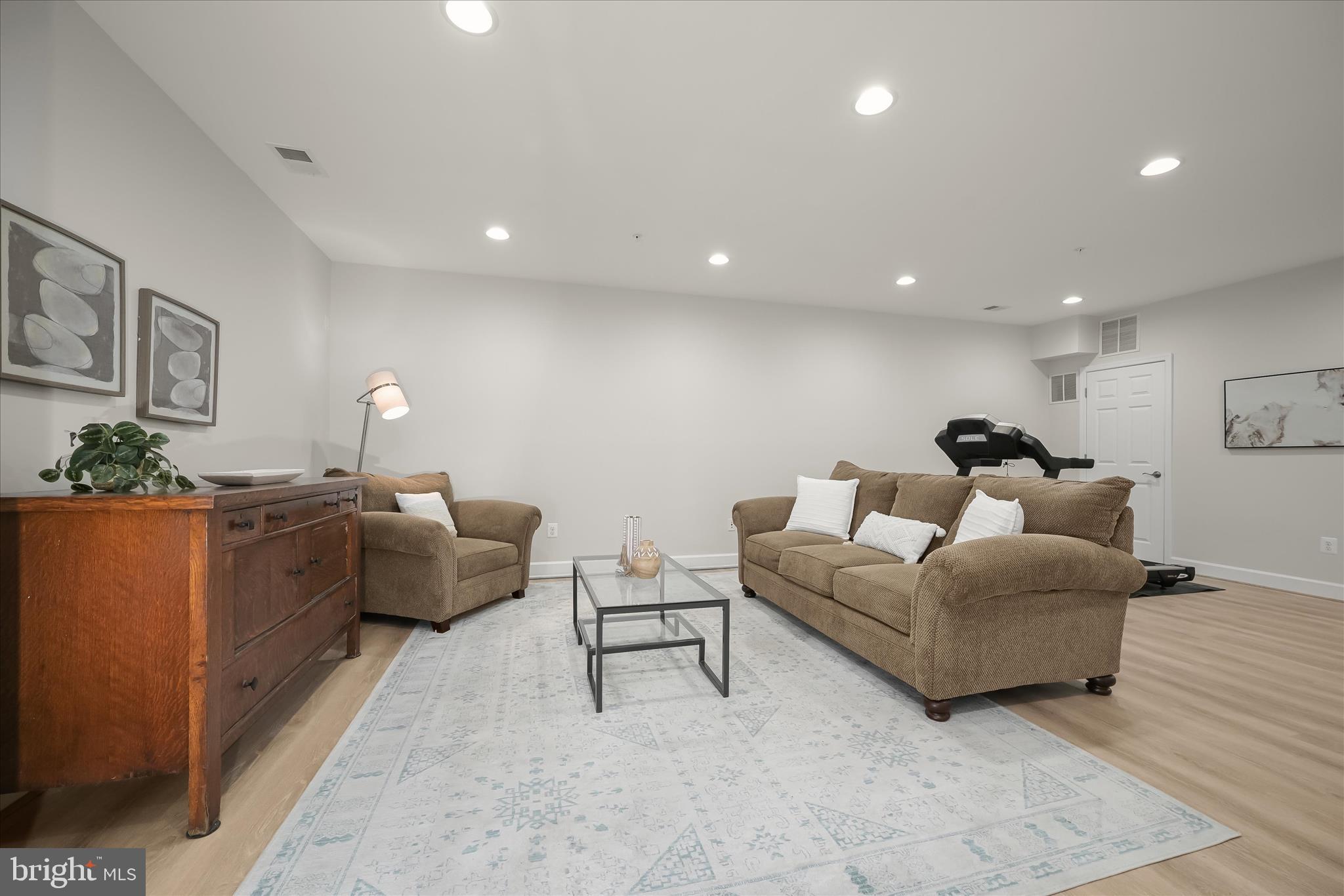 7905 Maple Lawn Boulevard Fulton, MD 20723 - Photo 36 of 49 a living room with furniture and a couch