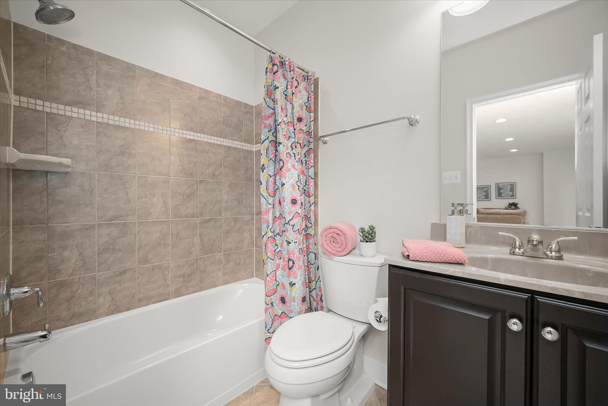 7905 Maple Lawn Boulevard Fulton, MD 20723 - Photo 39 of 49 a bathroom with a sink a toilet and a bathtub