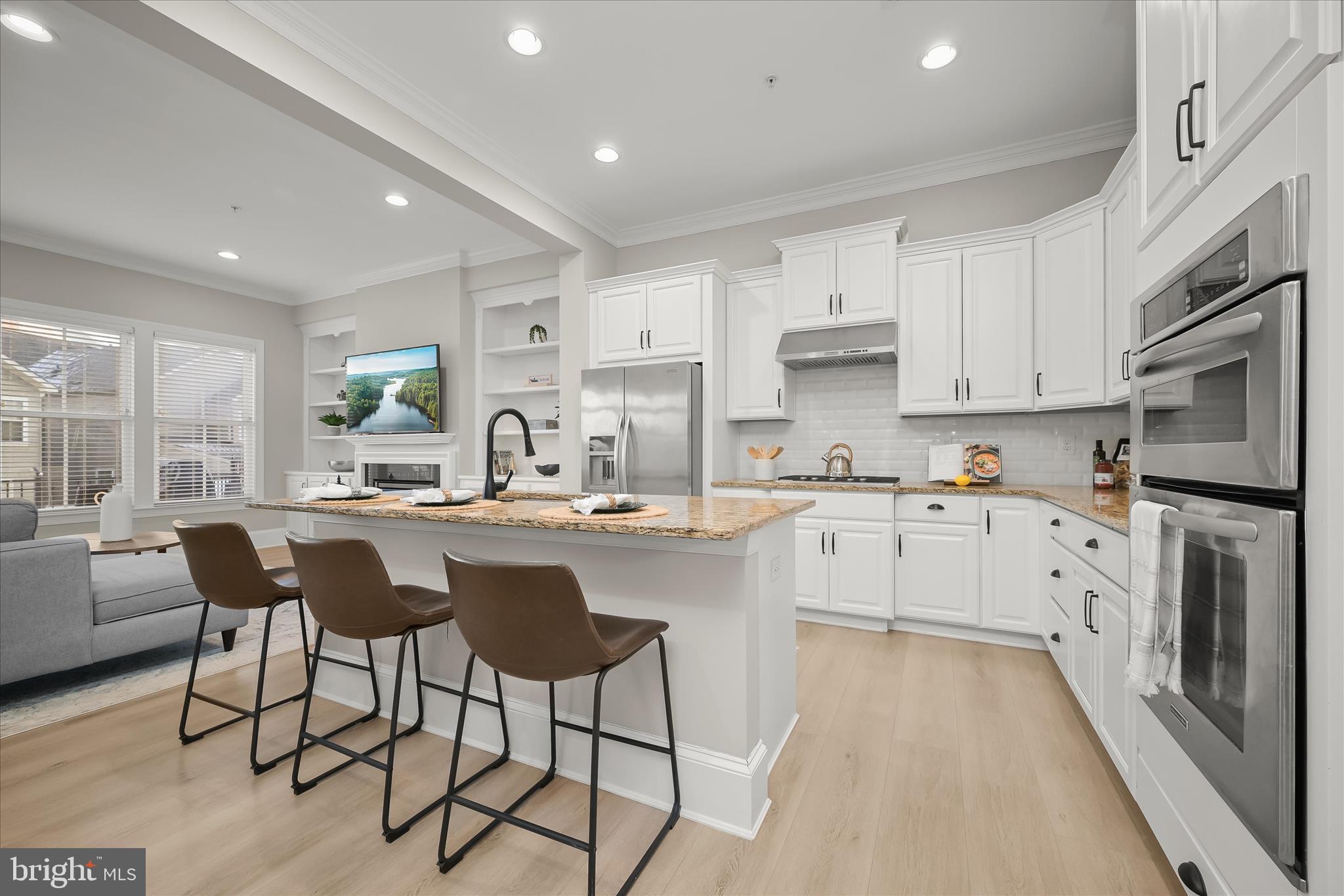 7905 Maple Lawn Boulevard Fulton, MD 20723 - Photo 9 of 49 a kitchen with appliances cabinets and a counter top space