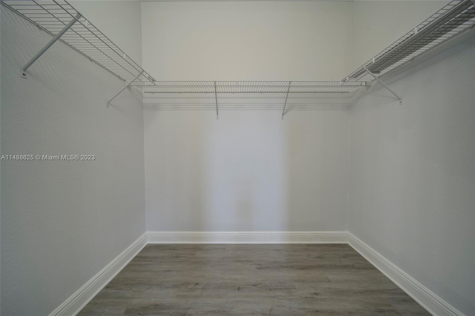 14679 Southwest 9th Street, Unit 1801 Pembroke Pines, FL 33027 - Photo 16 of 26 a view of a room with wooden floor
