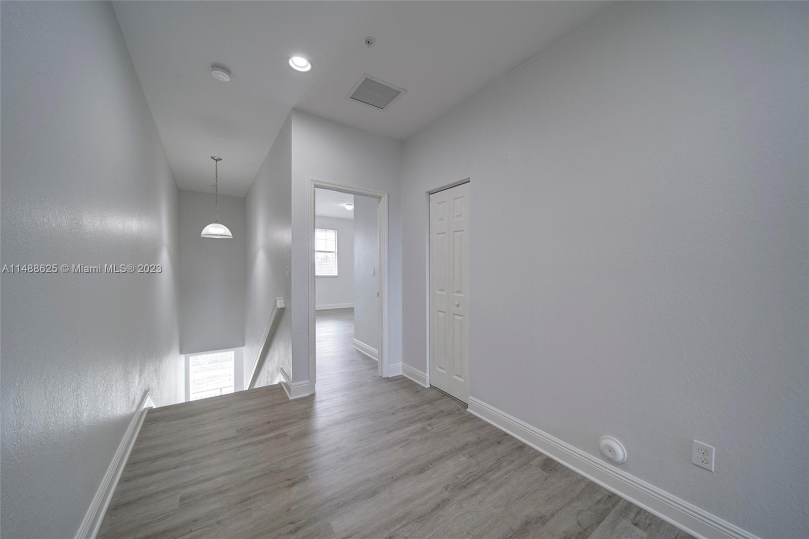 14679 Southwest 9th Street, Unit 1801 Pembroke Pines, FL 33027 - Photo 17 of 26 a view of an empty room with wooden floor