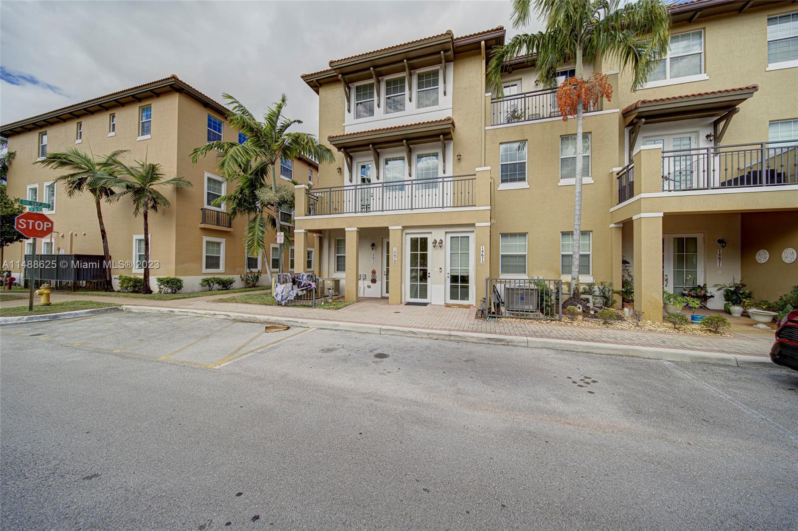 14679 Southwest 9th Street, Unit 1801 Pembroke Pines, FL 33027 - Photo 2 of 26 front view of a building with a street