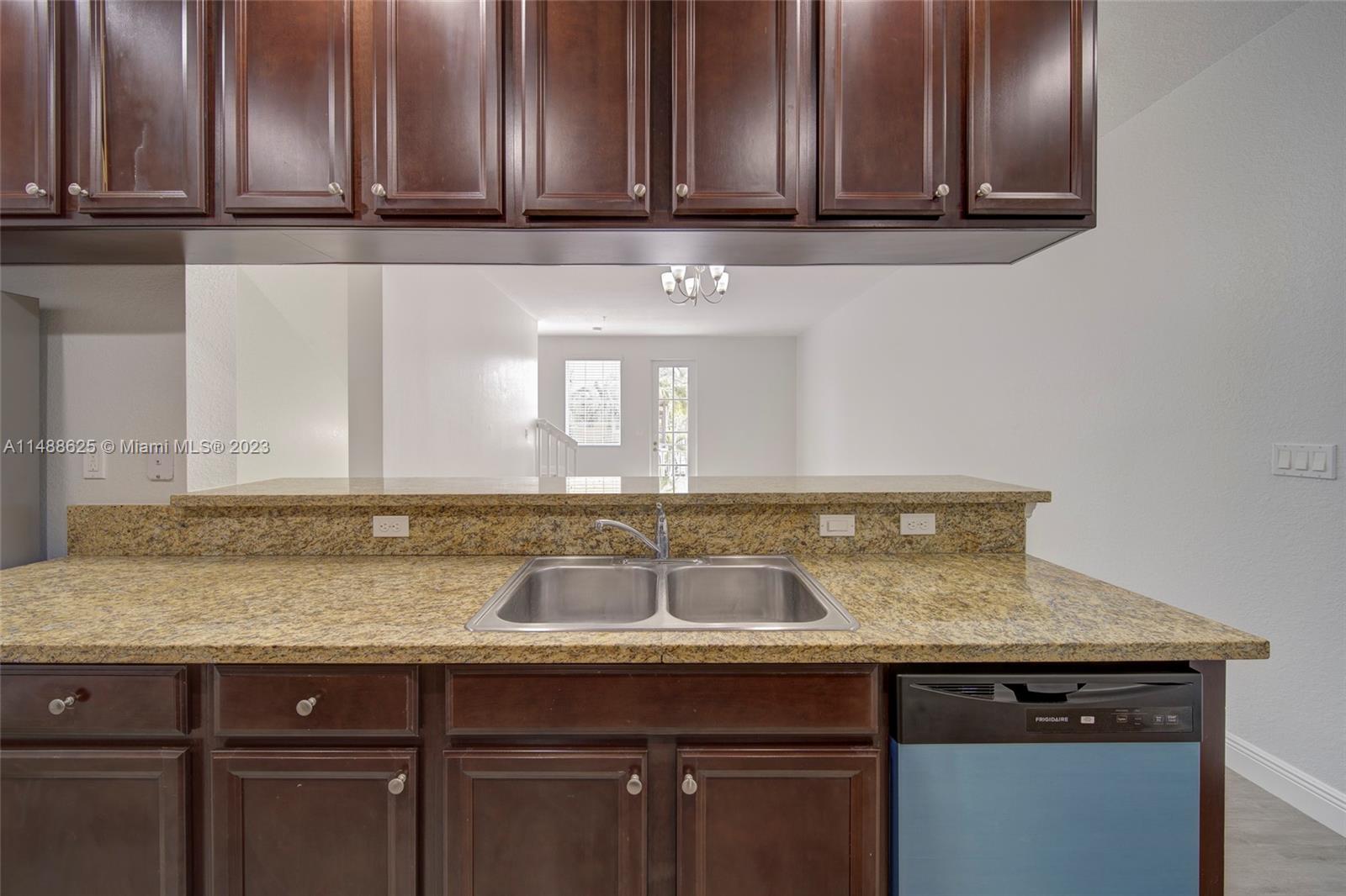 14679 Southwest 9th Street, Unit 1801 Pembroke Pines, FL 33027 - Photo 7 of 26 a view of a sink and cabinets