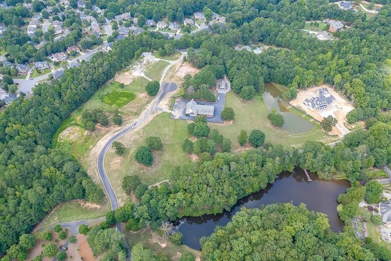 5755 Kennedy Road Buford, GA 30518 - Photo 19 of 23 an aerial view of residential house with outdoor space and swimming pool
