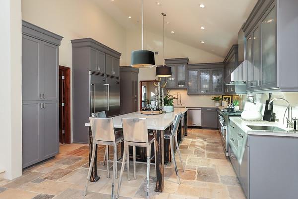 14480 Oak Place Saratoga, CA 95070 - Photo 13 of 50 a kitchen with stainless steel appliances kitchen island granite countertop a refrigerator and a stove top oven