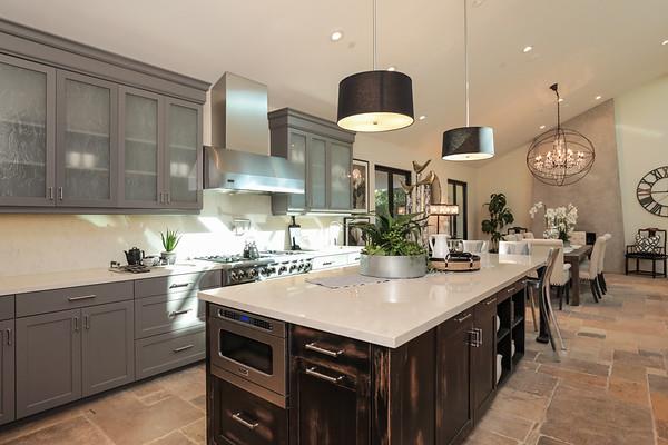 14480 Oak Place Saratoga, CA 95070 - Photo 14 of 50 a kitchen with stainless steel appliances a sink a stove cabinets and wooden floor
