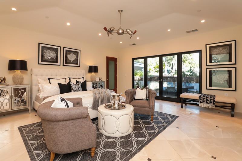 14480 Oak Place Saratoga, CA 95070 - Photo 20 of 50 a living room with furniture and floor to ceiling windows