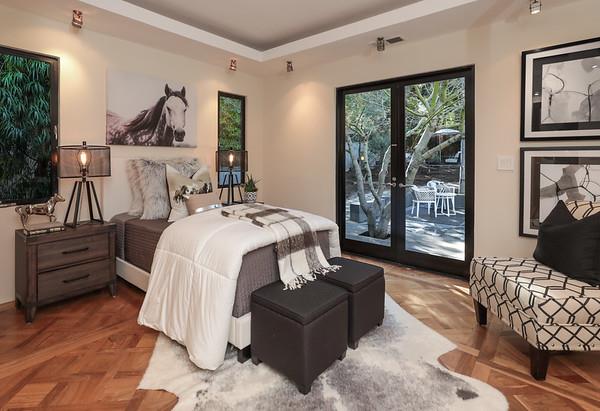 14480 Oak Place Saratoga, CA 95070 - Photo 25 of 50 a bed room with a bed and a painting on the wall