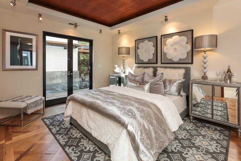 14480 Oak Place Saratoga, CA 95070 - Photo 27 of 50 a bedroom with a bed painting on wall and a large window