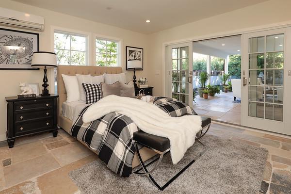 14480 Oak Place Saratoga, CA 95070 - Photo 28 of 50 a bedroom with a bed a lamp and large window