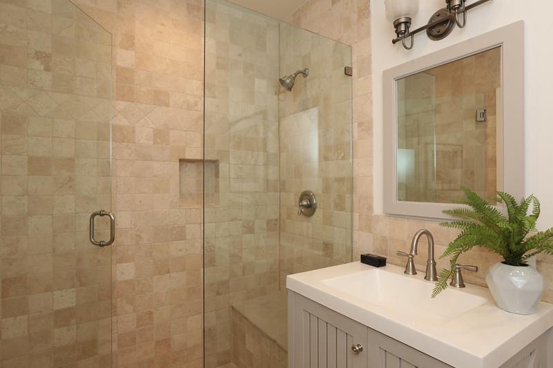 14480 Oak Place Saratoga, CA 95070 - Photo 29 of 50 a bathroom with a sink a mirror and a shower
