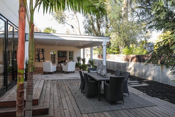 14480 Oak Place Saratoga, CA 95070 - Photo 36 of 50 a view of a patio with table and chairs potted plants and large tree