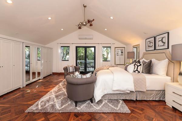 14480 Oak Place Saratoga, CA 95070 - Photo 42 of 50 a spacious bedroom with a large bed and a chandelier