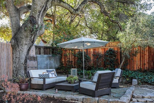 14480 Oak Place Saratoga, CA 95070 - Photo 46 of 50 a view of a patio with couches table and chairs under an umbrella
