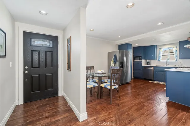 a view of kitchen with cabinets and wooden floor