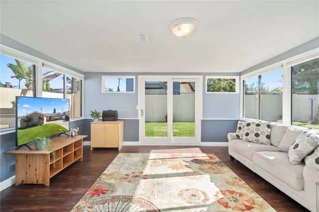 a living room with furniture and a rug