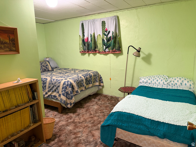 358 South Sky Drive Torrey, UT 84775 - Photo 39 of 82 Spacious room featuring light green walls, a textured ceiling, and patterned carpeting