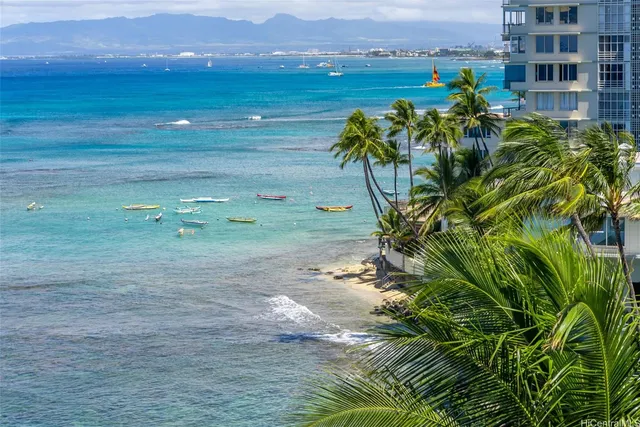 an outdoor space with patio and white umbrellas