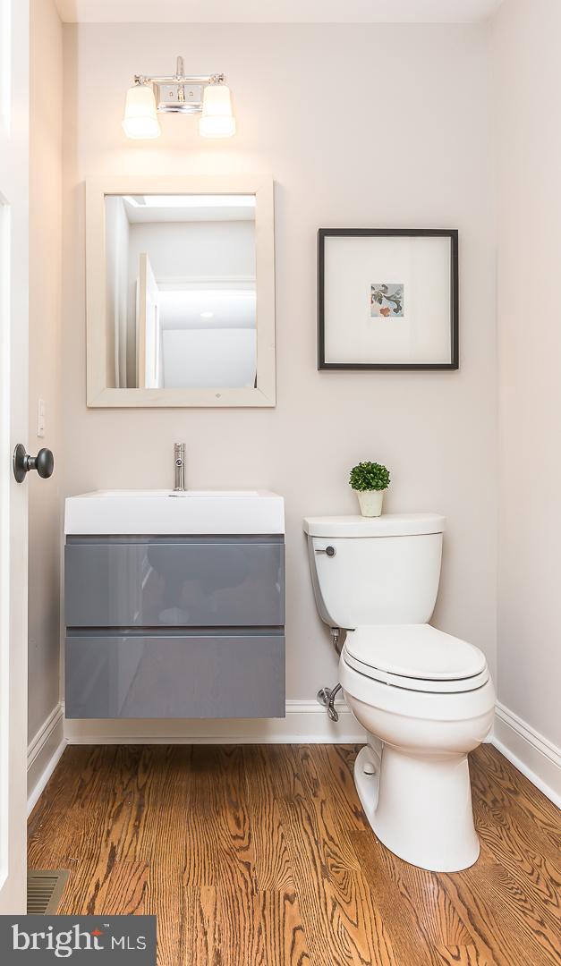111 West Montgomery Avenue, Unit 107 Ardmore, PA 19003 - Photo 14 of 44 a bathroom with a sink a toilet and mirror