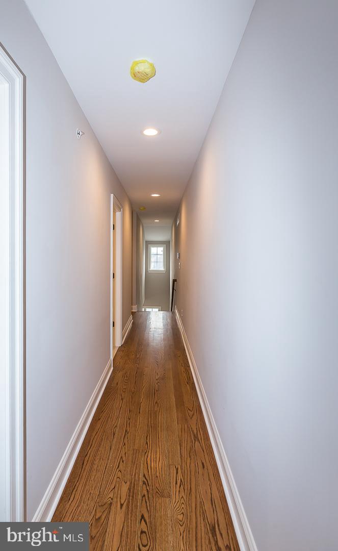 111 West Montgomery Avenue, Unit 107 Ardmore, PA 19003 - Photo 15 of 44 a view of hallway with wooden floor