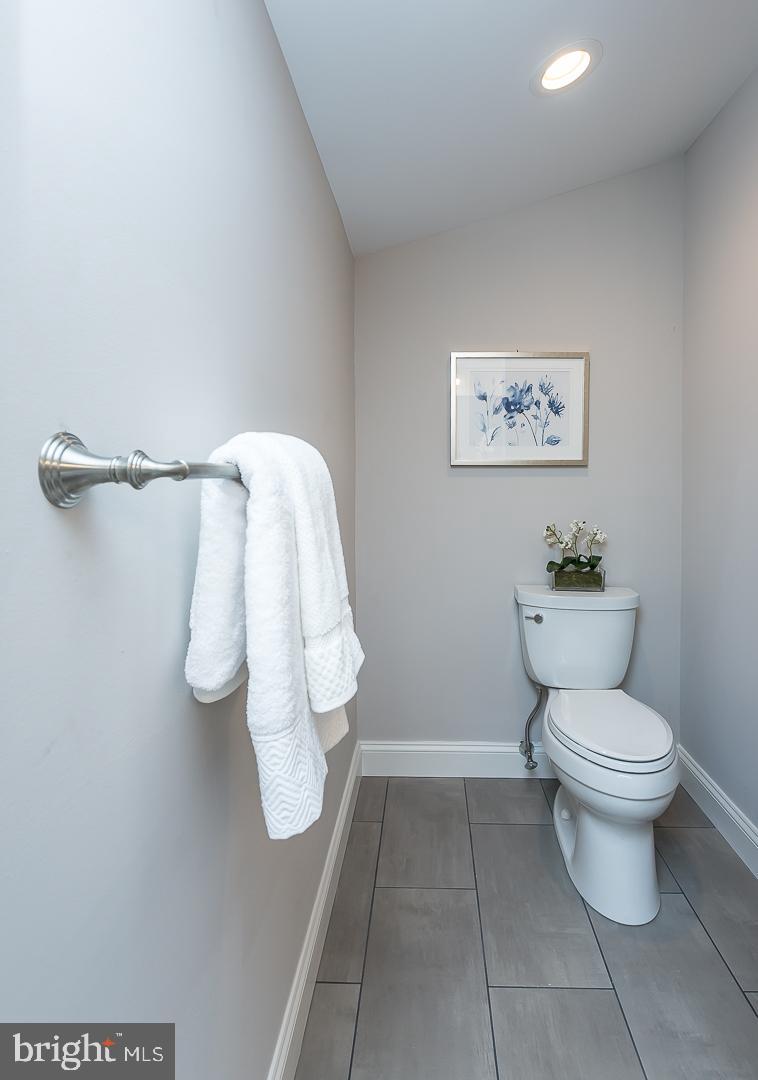 111 West Montgomery Avenue, Unit 107 Ardmore, PA 19003 - Photo 32 of 44 a bathroom with a toilet and a shower
