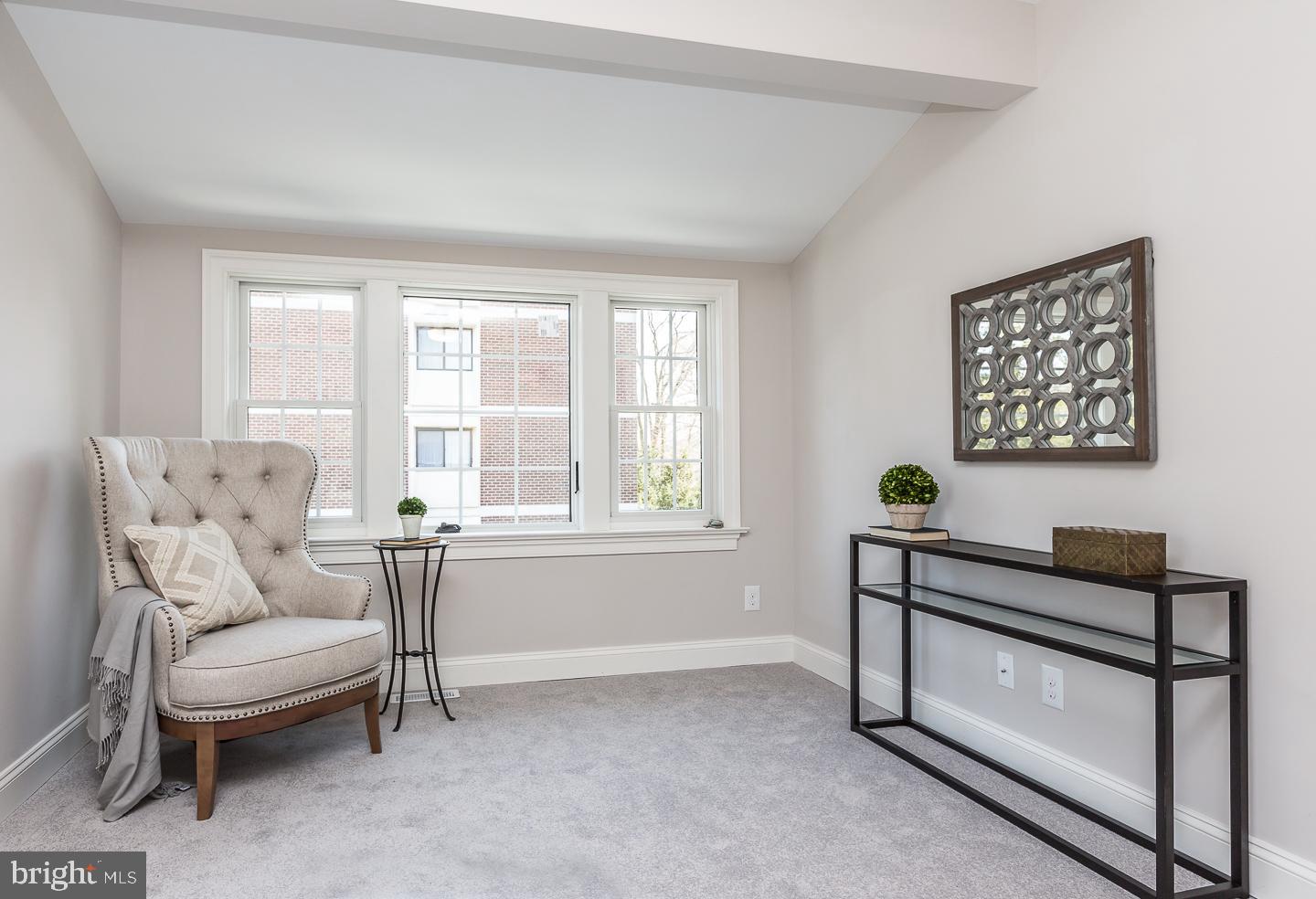 111 West Montgomery Avenue, Unit 107 Ardmore, PA 19003 - Photo 38 of 44 a living room with furniture and a window
