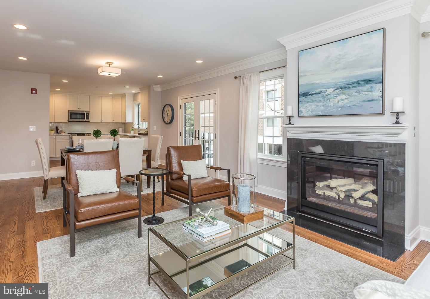 111 West Montgomery Avenue, Unit 107 Ardmore, PA 19003 - Photo 6 of 44 a living room with furniture and a fireplace