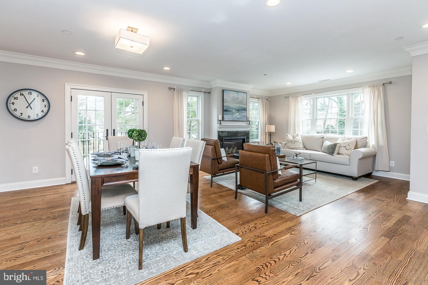 111 West Montgomery Avenue, Unit 107 Ardmore, PA 19003 - Photo 7 of 44 a living room with furniture a wooden floor and a large window