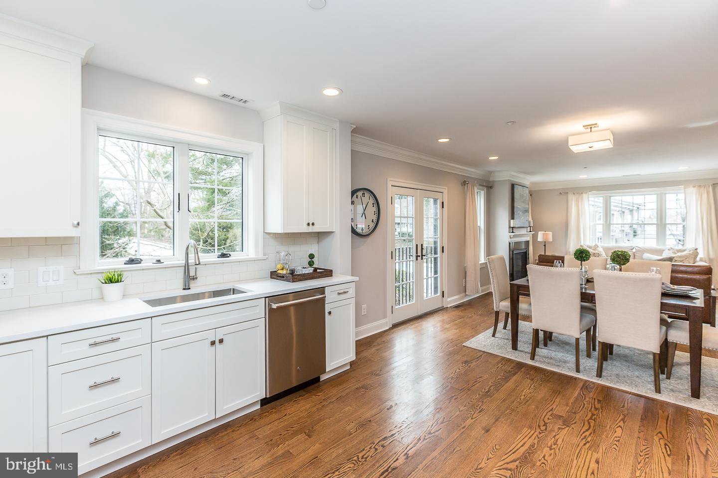 111 West Montgomery Avenue, Unit 107 Ardmore, PA 19003 - Photo 10 of 44 a large kitchen with cabinets wooden floor and stainless steel appliances