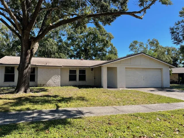 a house with trees in the background